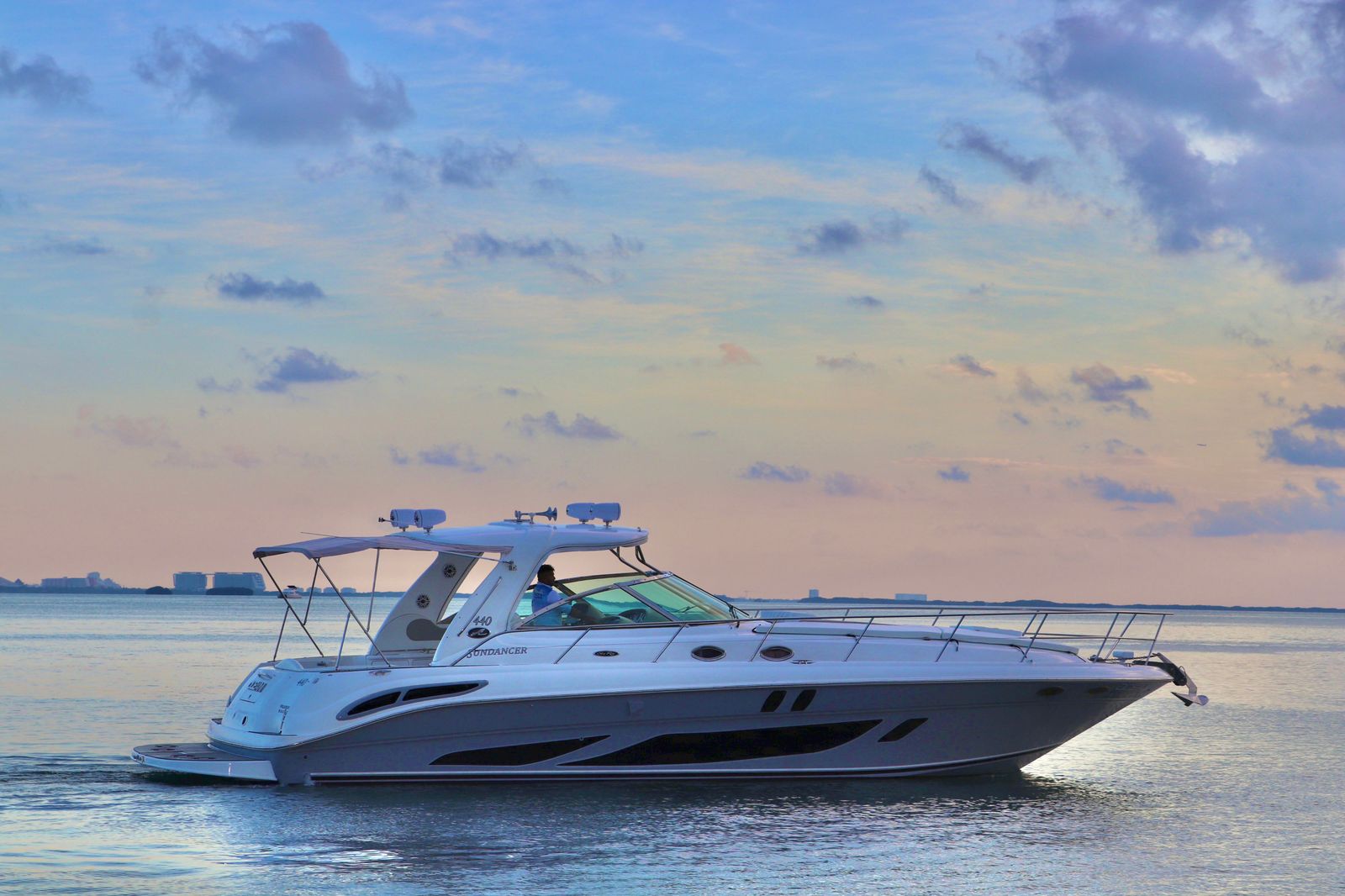 Private yacht charter Cancun golden hour sunset Sea Ray 440 Sundancer